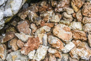 Pile of red and whte stones in a forest, Polish jurrasic.