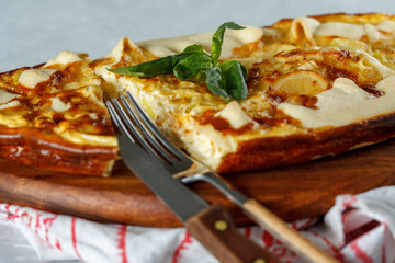 Homemade French open cake with leek and cheese. Quiche.
