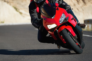  Man riding motorcycle in asphalt road curve with rural,motorcycle practice leaning into a fast...