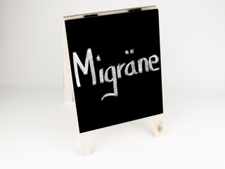 Tafel Schild mit Aufschrift Migräne