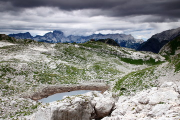 Afternoon storm clouds arrive at Seven Triglav Lakes Valley, with  Zeleno Jezero lake, Prehodavci hut and Jalovec peak in the background, Julian Alps, Triglav National Park, Slovenia, Europe