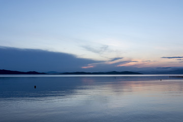 Beautiful seascape with mountains in Greece, at sunset