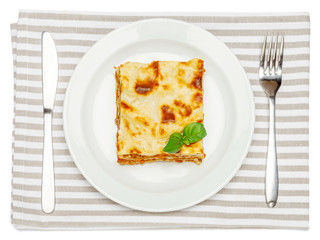 Portion of tasty lasagna isolated on white