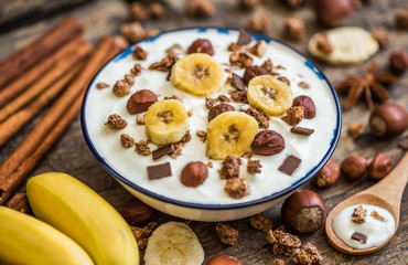 Serving of White Yogurt with  Muesli, Banana and Nuts