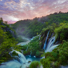 Fototapeta na wymiar Fairytale, misty morning over waterfalls in Plitvice park, Croatia