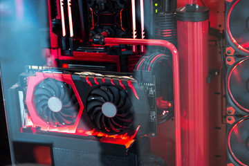 Inside a high performance computer. Computer circuit board and CPU cooling fans illuminated by internal LEDs inside a server class computer.