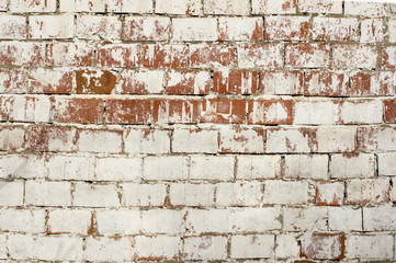 Multicolored peeling wall texture and background. Painted brickwork.