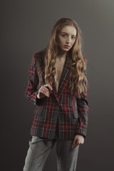 Pretty blonde woman posing for model tests  in checkered jacket