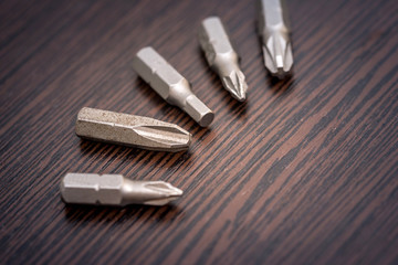 Set of drill bits on desk. close up.