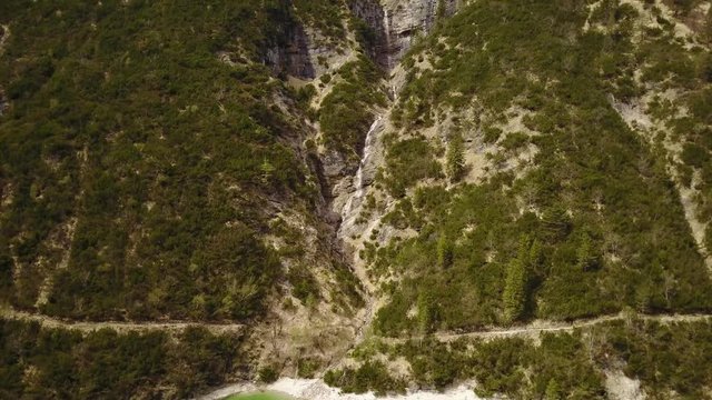 Aerial of flying upwards on a waterfall at the Achensee in the Austrian Alps