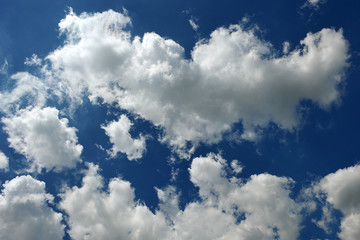 Blue sky. White clouds. Clouds. Blue.