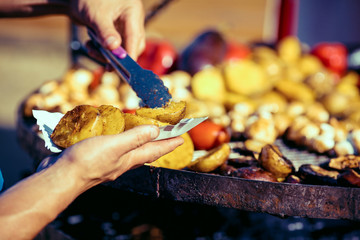Man cooking on barbecue for family dinner
