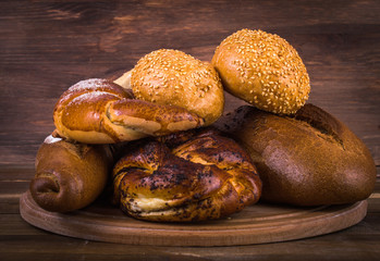 Bread and pastries on a wooden background