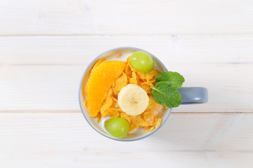 corn flakes with milk and fresh fruit © Viktor