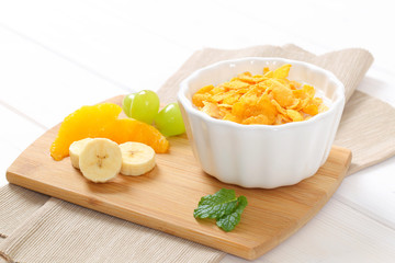 corn flakes with milk and fresh fruit © Viktor