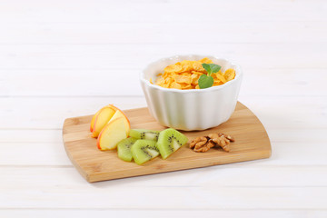 corn flakes with milk and fresh fruit © Viktor