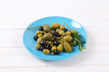 green and black olives with capers and caper berries