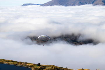 Threading the needle Parasailing through a hole in the cloud