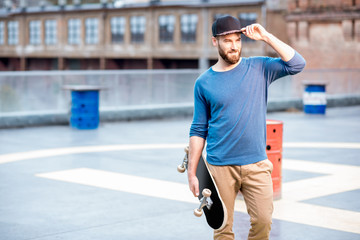 Portrait of a man with skateboard