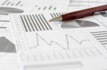 Business analytics, graphs and charts. A schematic drawing on paper. Pen