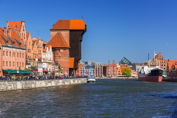 Fototapeta na wymiar Historic port crane at Motlawa river in Gdansk, Poland