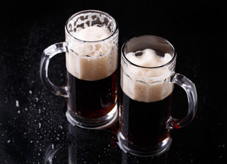Beer on empty black table