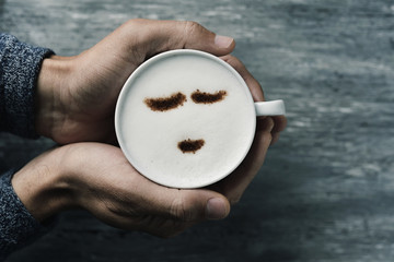 young man with a cup of cappuccino