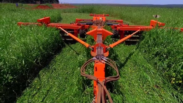 Tractor with a implement in a field