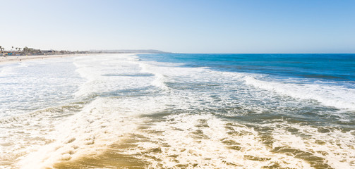 San Diego. Many kilometers of coast of Southern California. Surf of the ocean on the beach. Waves are ideal for surfing. 