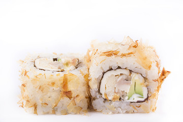 japanese Cuisine, Sushi Set: roll with shavings of tuna, eel, melted cheese, avocado on a white background.
