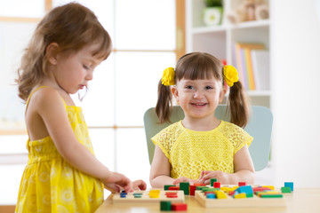 Caucasian child sisters playing together