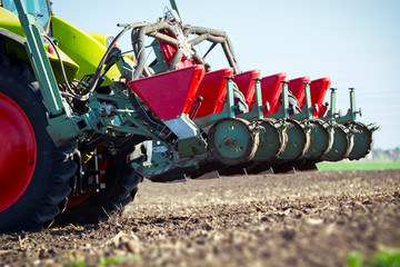 Naklejka premium Farmer seeding crops at field