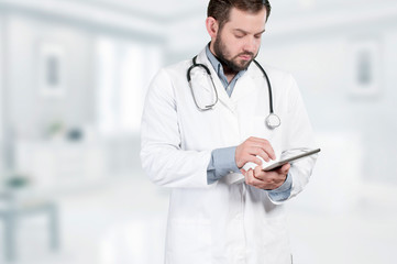 Doctor with stethoscope and digital tablet