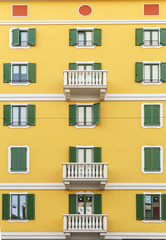 Beautiful facade of the building in one of the streets of Milan