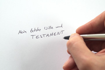 Hand writing Mein letzter Wille und Testament (German for My Last Will and Testament) in...