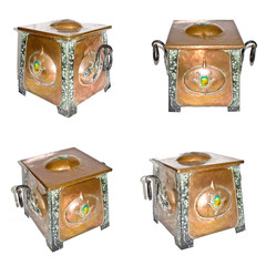 An Arts and Crafts copper coal box with iron handles and bindings