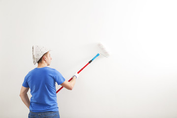  the painter whitewashed the wall of the room. © ballabeyla