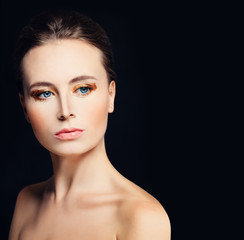 Perfect Model Woman on Dark Background. Healthy Skin and Golden Eye Shadow Makeup