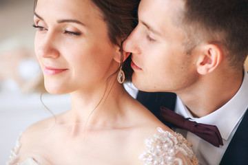 wedding couple on the studio. Wedding day. Happy young bride and groom on their wedding day. Wedding couple - new family.