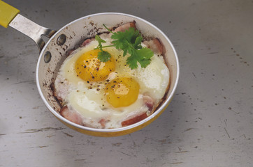 Two fried eggs in a frying pan