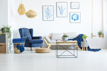 Room with navy blue armchair