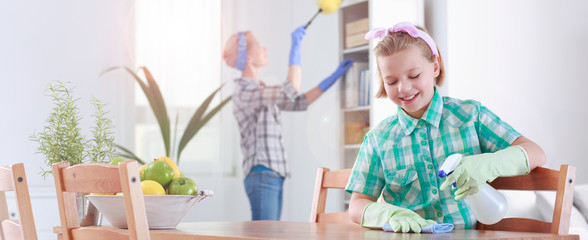 Girl helping her mother