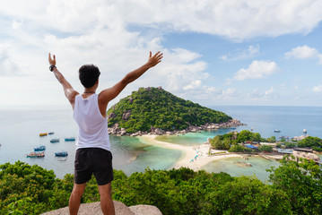 Beautiful women Traveller sitting  at viewpoint on island,Travel Vacation Lifestyle summer...