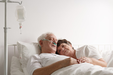 Lying next to sick husband