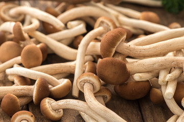 Shiitake mushrooms . mushrooms over wood table.

