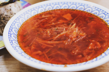 red Ukrainian borsch . Close-up, selective focus.