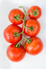Close up red cherry tomato on white background isolated.