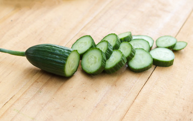 Close up cucumber slice on wood table  background.