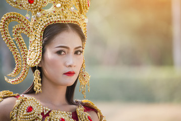 A beautiful woman in dancer apsara costume at stone castle,public place in Thailand