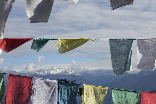 Asia, Bhutan, Dorcha La Pass. Himalayas seen through prayer flags.